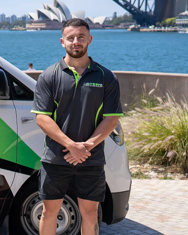 Nick Stein, founder of Stein's Electrical, by his van at Sydney Harbour