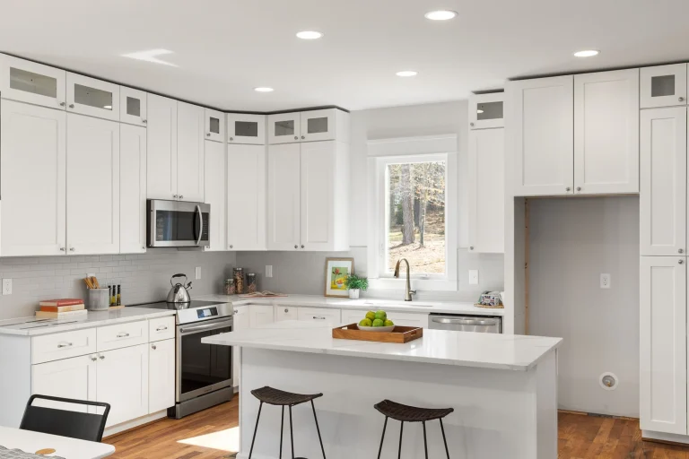 Modern white kitchen with downlights after a renovation