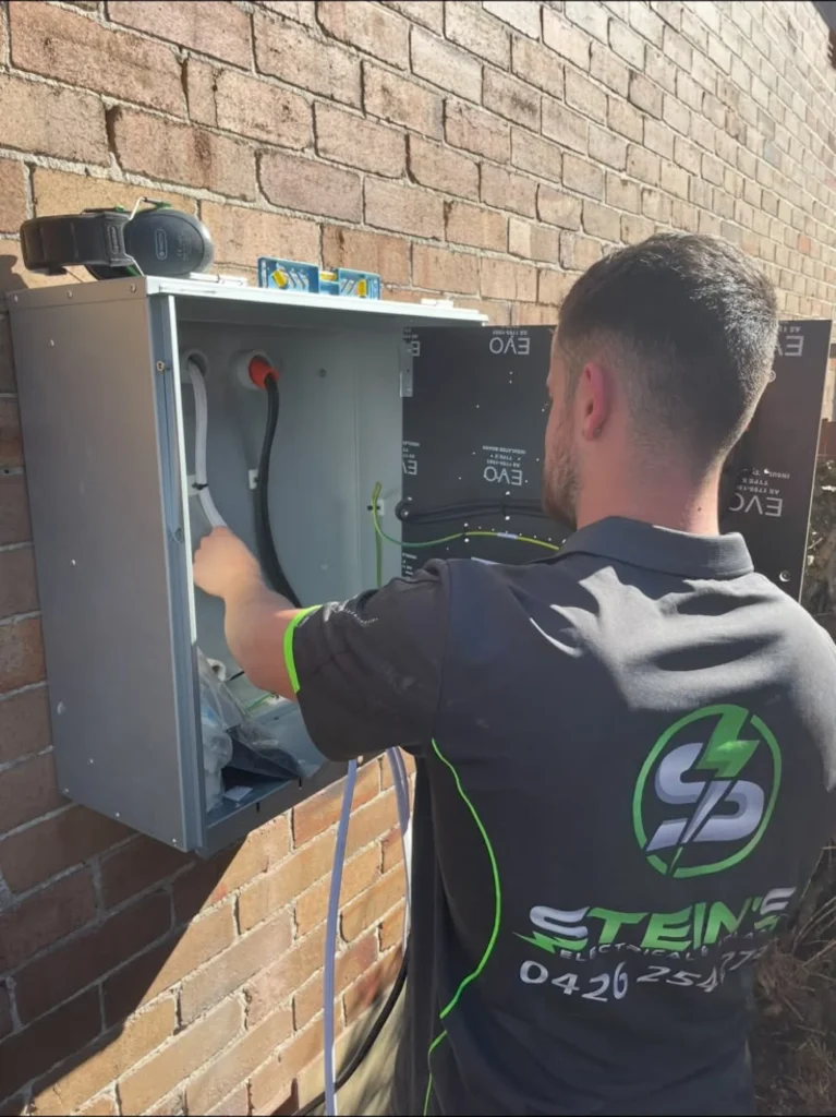 Stein's electrician fitting a new meter box